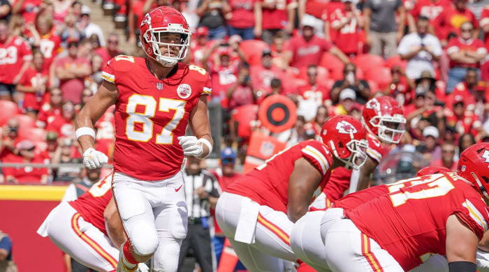 Aug 20, 2022; Kansas City, Missouri, USA; Kansas City Chiefs tight end Travis Kelce (87) goes in motion behind the line against the Washington Commanders during the game at GEHA Field at Arrowhead Stadium.